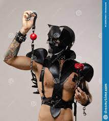 A Man in a Bdsm Mask of a Skull Demon with a Gag, Dressed in a Leather  Cloak with Leather Bracelets and Straps on the Stock Image - Image of lgbt,  pleasures: