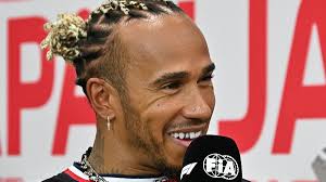 Lewis Hamilton wears a gold tooth grill as fashion loving Formula One ace  fields questions ahead of the Japan Grand Prix