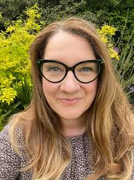 This is what 46 looks. Happy birthday to me. 🥳 Photo description for  anyone who needs it. It's me! In my garden with greenery behind me. I'm  wearing new make up I