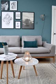 The feature wall of this seating lounge is deliberately left as featureless as possible, so as not to pull attention away from the display of decoration. Accent Wall Ideas You Ll Surely Wish To Try This At Home Bedroom Living Room Ideas Painte In 2021 Teal Living Rooms Living Room Decor Gray Accent Walls In Living Room
