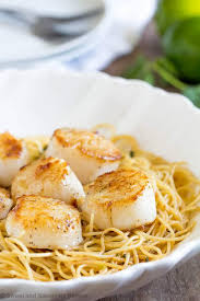 Add scallops, tomatoes and garlic; Tequila Lime Seared Scallops Pasta Sweet Savory