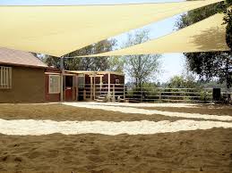 Photo shows parking lot before planting of numerous shade trees. Shade Sail Patio Covers Superior Awning