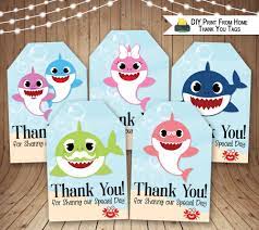 The design of our free tags feature an adorable baby shark character in front of an ocean blue background and sea weed silhouette. Pin By Noopur Vora On Shaaz Second Birthday Gift Tags Diy Diy Prints Gift Tags Printable