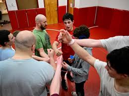 Through his father's death and battle with leukemia, wrestler Aidan  Halloran never gave up