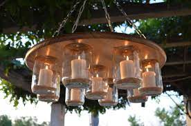 You can make this chandelier all your own by picking a special vintage chandelier. Pin By Mrs Emmert On Mason Jars Rustic Chandelier Outdoor Candle Chandelier Mason Jar Chandelier