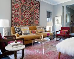 Find the perfect decorative accents at hayneedle, where you can buy online while you explore our room designs and curated looks for tips, ideas & inspiration to help you along the way. Colorful Eclectic Living Room With Floral Wall Tapestry Mustard Yellow Sofa And Faded Red Rug Hgtv