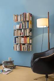 By articulating the wall section itself with bookcases, the threshold itself is legitimised as a library. Wall Shelves And Bookshelves Design Shelf Design Contemporary Shelf Design Shelves