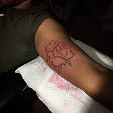 A large tattoo of three roses together. Rose Tattoo Inner Bicep Best Tattoo Ideas Gallery