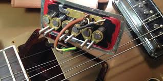 In this ultimate guide on electric guitar pickups, we'll explore humbuckers vs single coil pickups, active pickups vs passive, and the overall question of how do guitar pickups work? Guitar Pickups 101 Premier Guitar