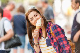 Maybe you would like to learn more about one of these? Woman Eating Ice Cream On Vacation Travel Smiling Girl Having Stock Photo Picture And Royalty Free Image Image 42350141