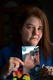 Bank robbery, shooting leave family with questions