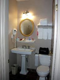 If a house has a smaller door on a bathroom, it might be because a bathroom generally doesn't need to be able to let large pieces of furniture into it, whilst a bedroom does. Small Bathroom With Bath Shower Tub Behind The Door Picture Of Ramada Limited Vancouver Downtown Tripadvisor