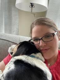 Family adopts dog from pet refuge