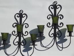Many people believe that a candle lit in ones home pleases the fire element and brings good fortune to the aura of the house. Vintage Wrought Iron Wall Sconces Hanging Chandelier Candle Holders