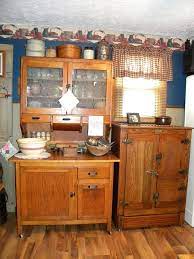 Sink, western electric stove, and cabinet in a model kitchen. 1905 Ideal Cabinet Company Vincennes Ice Chest Antique Kitchen Cabinets Hoosier Cabinets Rustic Cabinets