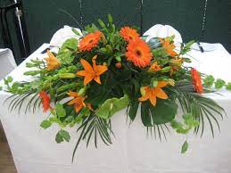 Long Low Table Arrangement Gerberas Asiatic Lilies Anthuriums Molucella Bells Of Irela Table Flower Arrangements Top Table Flowers Wedding Top Table Flowers