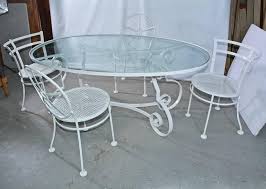 The warm natural finish and rich steely legs on this round wicker chair make for a dynamic combo that is decorative patio wicker chair: Oval Metal And Glass Midcentury Patio Porch Garden Table And Four Dining Chairs At 1stdibs