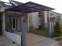 Sebuah carport yang cukup lebar berada di bagian depan rumah. Model Carport Minimalis Modern Inspiratif Metro Properti