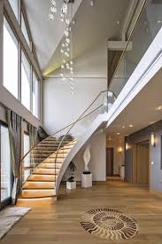 See more ideas about modern stairs, stairs design, staircase design. Double Height Entrance And Sweeping Staircase Makes For Grand Statement To Guests And Residents Alike Staircase Design Stairs Design Self Build Houses
