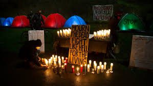 Eugene activists gather vigil to honor those who died while homeless