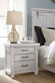 And the easy on the eyes distressed white finish? Brashland 4 Piece Panel Bedroom Set In White
