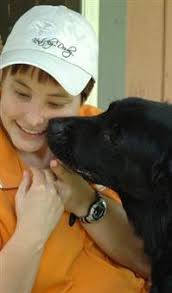 Wilderwood organization trains dogs to help people with brain disorders