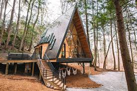A large wraparound deck expands the interior living space during the warmer months. 15 Best Airbnb Cabins You Can Rent To Get Off The Grid