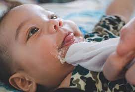 Baby Spitting Up Curdled Milk Causes Treatment