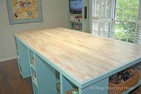 Add cabinets to your table for a transformative workbench! Diy Craft Room Inspiration For A Budget Makeover