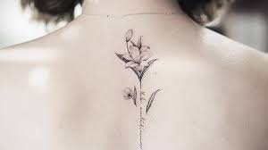 Minimalist Flower Tattoo Designs You Should Get According To Your Personality Lily Flower Tattoos Tattoos Flower Tattoo
