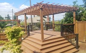 Most deck builders bolt pergola support posts to the frame of the deck using (2) 1/2 x 6 lag screws with washers per post. Azek Vintage Mahogany Deck With Pergola Deck Masters Llc