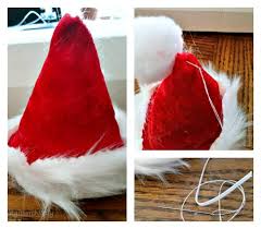 Wrap the body of the doll in red felt; How To Prepare Your Pets For The Holidays Diy Pet Santa Hat Tutorial Kicking It With Kelly