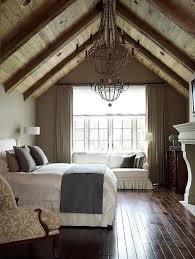Traditional Guest Bedroom With Exposed Beam Interior Wallpaper Hardwood Floors Cathedral Ceiling Chandelier Home Farmhouse Master Bedroom Home Bedroom