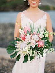We will work with you to achieve the look of your dreams, listen to your ideas and make expert unbelievably gorgeous! Tropical Bridal Bouquet With King Protea Ginger Orchids Monstera Leaf Tropical Wedding Flowers Tropical Bridal Bouquet Tropical Wedding Bouquets