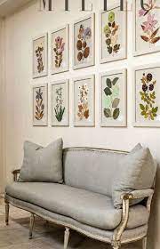 Vividly Colorful Framed Botanicals Hung Above A French Settee In An Elegant Home In Houston With Interiors D White Interior Design Inspiration Home Decor Decor