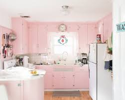 25 Pastel Kitchens That Channel The 1950s Pink Kitchen Cabinets Pink Kitchen Pink Kitchen Designs