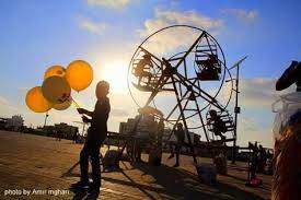 أجواء عيد الاضحى المبارك في مخيم النصيرات وسط قطاع غزة تصوير امير المغاري ferris wheel grounds travel