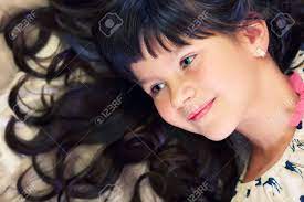 The unscientific translation means that a baby can be born with just about any eye color, regardless of what their parents have. Closeup Portrait Of Beautiful Little Girl With Curly Hair And Stock Photo Picture And Royalty Free Image Image 23932400