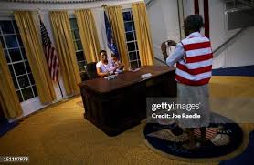 Fredericka Bryant photographs Sloan Brant in a mock Oval Office of... News  Photo