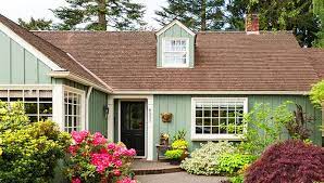 Stucco exterior, slate roof, and a new garden shed near the street. Pick The Perfect House Color Exterior Paint Colors For House Green House Exterior Green Exterior Paints