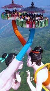 Maybe you would like to learn more about one of these? This Flying Kiss Ride In China On Top Of A 3 000 Ft Cliff Is A Marvel Tucked In The Clouds Viral Bake
