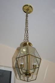 A Light Fixture Goes From Brass To Class Brass Light Fixture Makeover Brass Light Fixture Light Fixtures