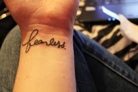 In the jewish religion, the red string is tattooed on one's wrist as a symbol of protection from the evil eye. Fearless