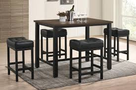 The rectangular table top sits above block legs with tapered bases, offering sophisticated style. Dining Room Sets Gardner White