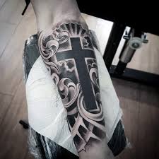 This black and grey half sleeve is another good example of the polynesian tattoo style. Black Grey Mystic Cross In Clouds Tattoo Design On Forearm