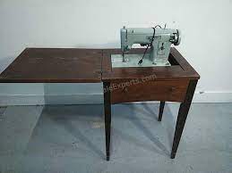 First, let's take a look at a vintage sears kenmore sewing machine in a cabinet. Sears Kenmore Vintage Sewing Machine With Cabinet Estatesaleexperts Com