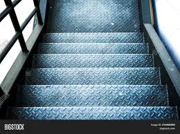 Even though different steel sections are used as building stair stringers, one thing that is very like steel framed stairs, wood framed stair stringers also use 12 inches deep members typically 2x12. Industial Steel Stair Image Photo Free Trial Bigstock