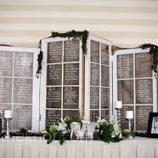 Reused Windows To Display Seating Arrangements At Wedding