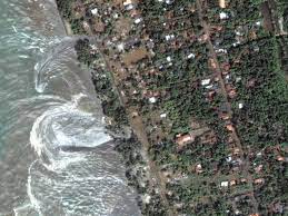 The pictures below are indeed real pictures, but of a tidal bore, not a tsunami. Photo Gallery Tsunamis National Geographic