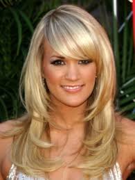 A carrie underwood hairstyle you can do for a regular shopping trip so that hair does not interfere, or for a gala evening, under a beautiful evening dress. Pictures Carrie Underwood Hairstyles Carrie Underwood Layered Hairstyle With Bangs